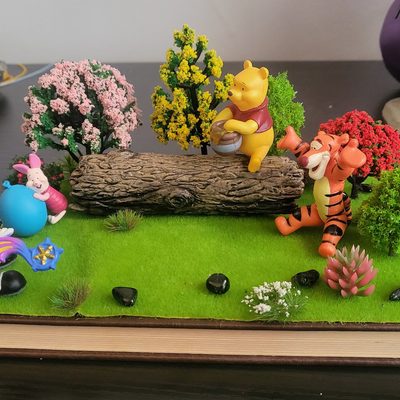 Winnie the Pooh on a book, featuring Sora